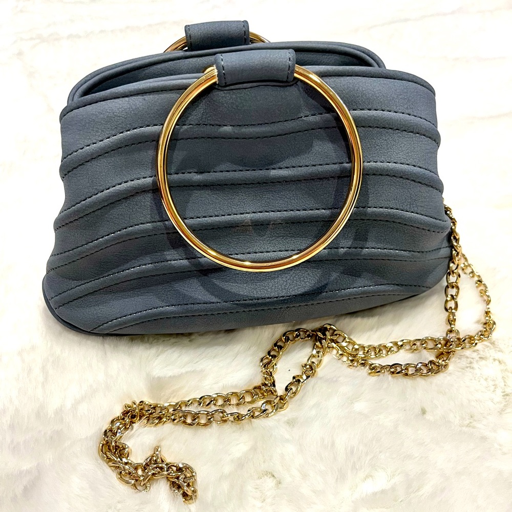 Blue shell shape leather bag with metal chain